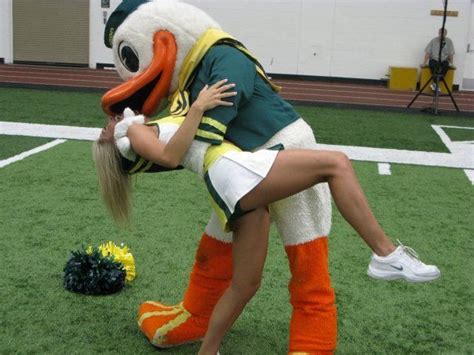 Oregon Ducks Cheerleader And Mascot Kissing We Love Our Ducks Pinterest Football Oregon