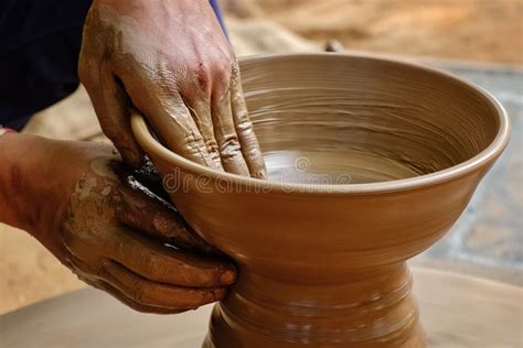 Pottery Skilled Wet Hands Of Potter Shaping The Clay On Potter Wheel