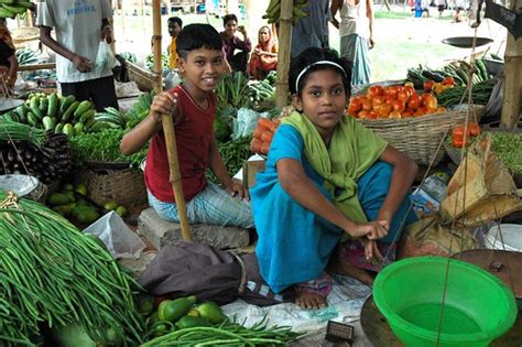 market vegetable vendors  bright kids  boy  girl flickr