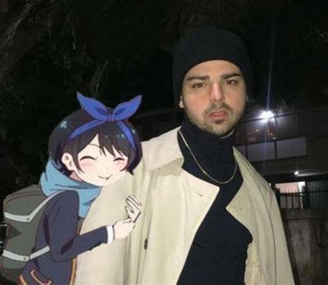 A Man Standing Next To An Anime Character