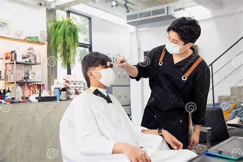 Asian Male Hairdresser Make Hairstyles For Asian Male Customers In