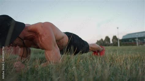 Bodybuilder With Naked Torso Doing Exercise Plank Bifurcation And