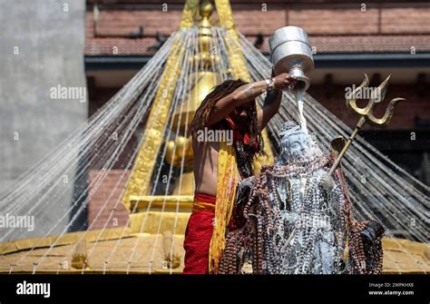 March 8 2024 Kathmandu Bagmati Nepal A Hindu Priest Offers Milk On