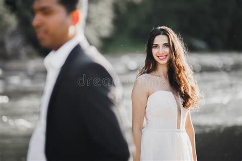 Elegant Stylish Happy Blonde Bride And Gorgeous Groom On The Background