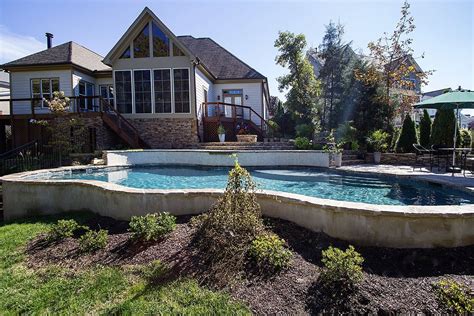 Lovely Pool Built On A Lot With Extreme Yard Slope Backyard Pool Landscaping Backyard Pool