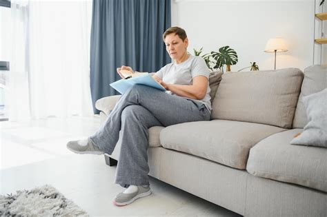 Premium Photo Portrait Of A Happy Mature Woman Relaxing On Couch And