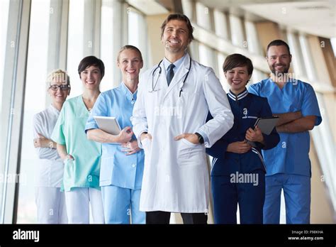 Group Of Medical Staff At Hospital Handsome Doctor In Front Of Team