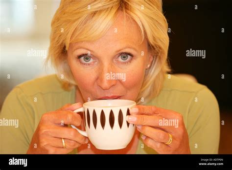 Mature Woman Drinking Tea Model Released Stock Photo Alamy