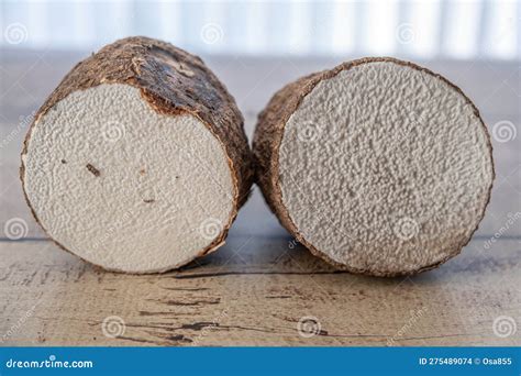 A Tuber Of Yam Cut In Two Ready For Cooking Stock Photo Image Of