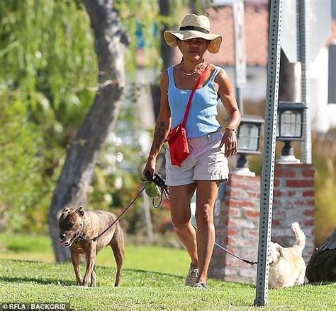 Meghan Markle's mother Doria Ragland, 66, unveils floral tattoo as she ...