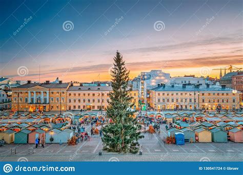 a christmas tree in the middle of a city square