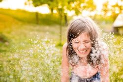 Girl In Bikini Dancing At The Sprinkler Summer Garden Containing