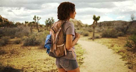 Cute African Woman Hiking Joshua Tree National Park On Hike In Mojave