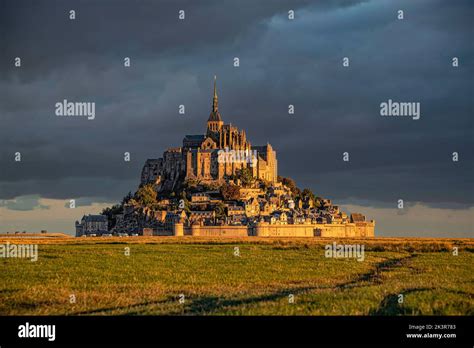 Breathtaking sunrise at the famous Le Mont Saint-Michel tidal island , Normandy, France Stock ...