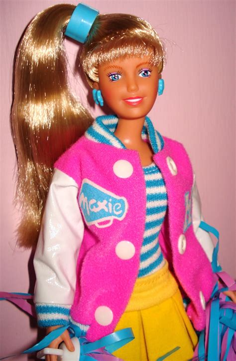 A Barbie Doll With Blonde Hair Wearing A Pink Jacket And Yellow Skirt