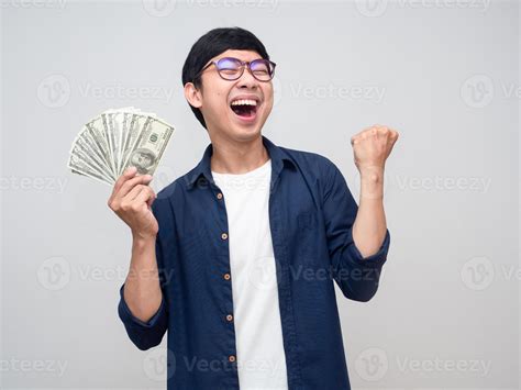 Young Asian Man Holding Money Show Fist Up Apreeciate Happy About Earn