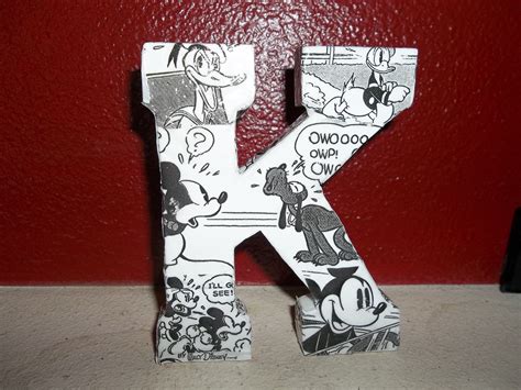 The Letter K Is Made Up Of Mickey Mouse And Other Cartoon Characters