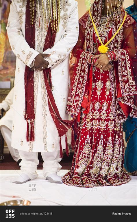 Traditional clothing worn by Hindu bride and groom at wedding, Toronto, Ontario, Canada stock ...