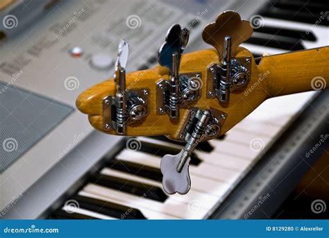 Guitar and Upright Electro-piano Stock Photo - Image of chrome, musical: 8129280