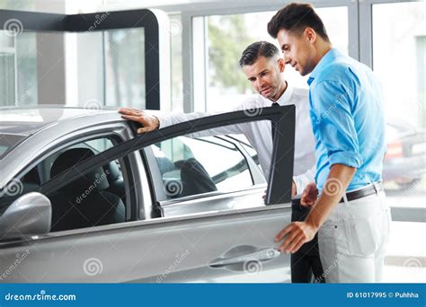 Car Showroom Vehicle Dealer Showing Young Man New Car Stock Image