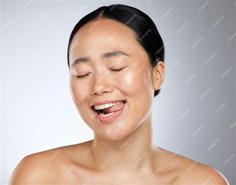 Premium Photo Woman Face Tongue Out And Beauty Skincare Natural