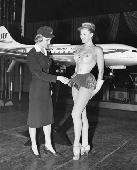 Swedish Stewardess Birgitta Lindman With The Swedish Sas Airline Examines A Showgirls Costume