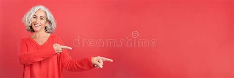 Smiley Mature Woman Pointing To The Side Stock Image Image Of