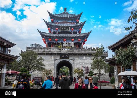 Tourists Walk Through Wuhua Tower In Dali Ancient Town In Dali City