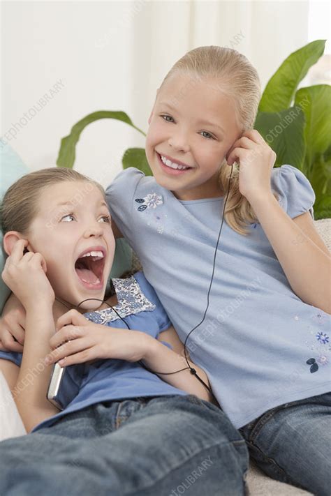 Two Girls Listening To An Mp3 Player Stock Image F0035981