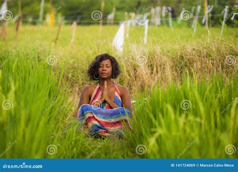 Young Beautiful And Happy Black African American Woman Sitting At Rive