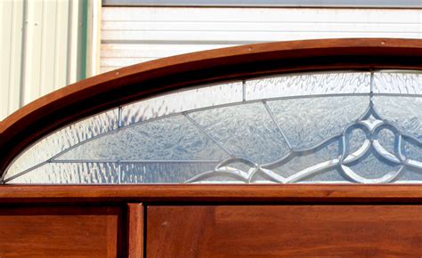 Oval Glass Doors With Arched Transom Window