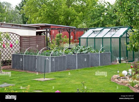 Raised Beds And Greenhouse In An Allotment Garden Stock Photo Alamy