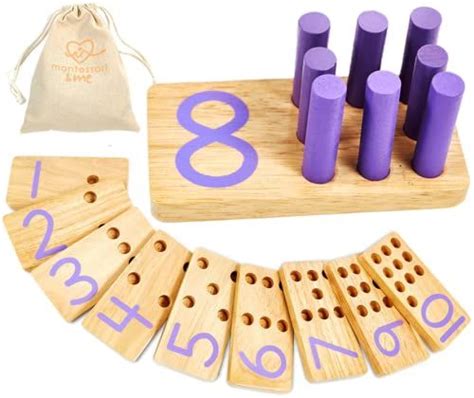 A Wooden Game Set With Purple Numbers And Matching Pegs In Front Of A