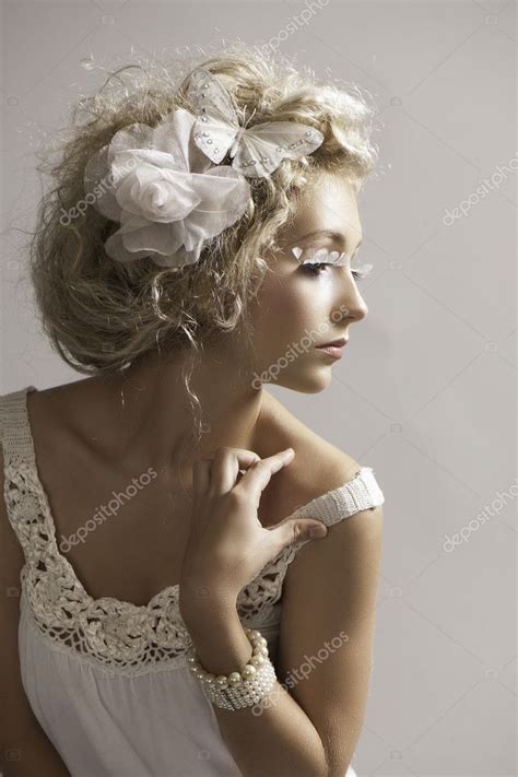 Beautiful Petite Blonde Woman In White Fantasy Makeup And Clothes Stock Photo Salomephoto
