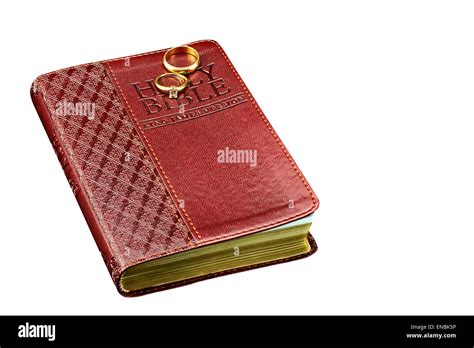 Closed Studio Prop Bible Cover With Gold And Diamond Wedding Rings