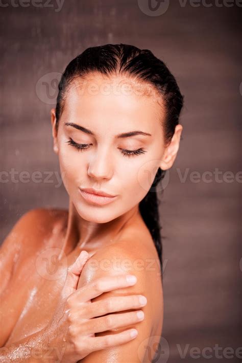 Beauty In Shower Beautiful Young Shirtless Woman Standing In Shower And Washing Her Shoulder