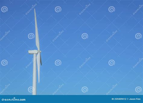 Close Up Side View Of Windmills With Blue Sky Background On A Sunny Day