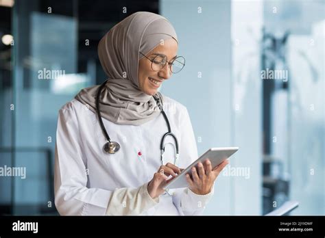 Female Doctor In Hijab Works In Modern Clinic Office Muslim Female