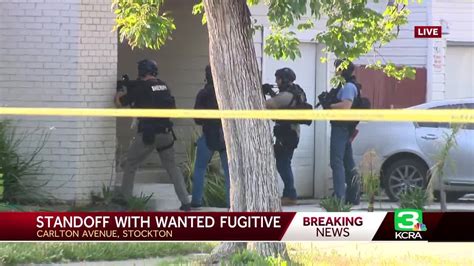 Man Taken Into Custody After Barricade Situation Involving Fugitive In