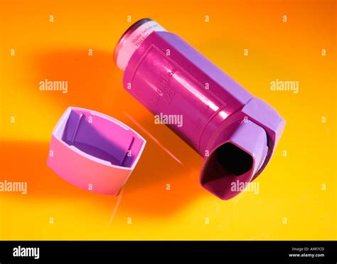 ASTHMA INHALER ON YELLOW BACKGROUND Stock Photo - Alamy