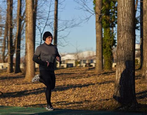 Mature Man Running In The Park With Headphones Stock Photo Image Of
