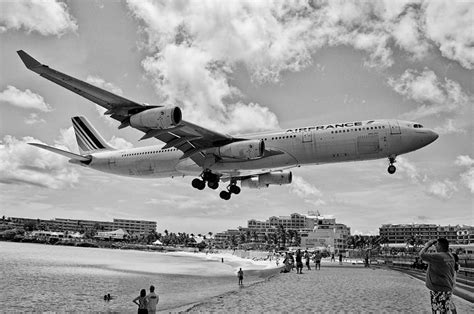 Airbus A340 landing over the beach Photograph by Jiri Vatka