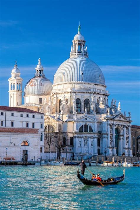 Grand Canal With Gondola Against Basilica Santa Maria Della Salute In Venice Italy Stock Image