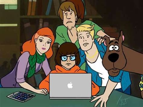 The Cast Of Scooby And Friends Sitting At A Table In Front Of An Apple