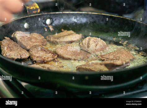 Cooking Loin Steaks In A Frying Pan Stock Photo Alamy