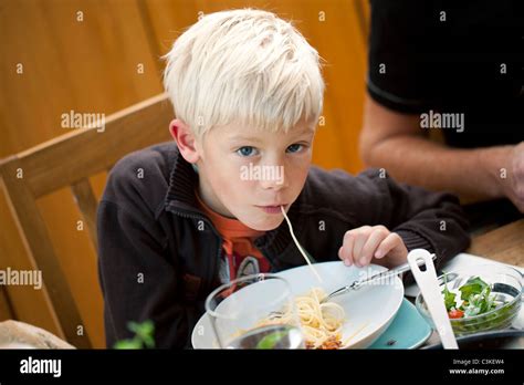 Boy Eating Spaghetti Stock Photo Alamy