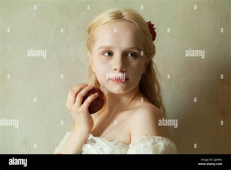 Portrait Of Cute Blonde Woman With Red Apple Stock Photo Alamy
