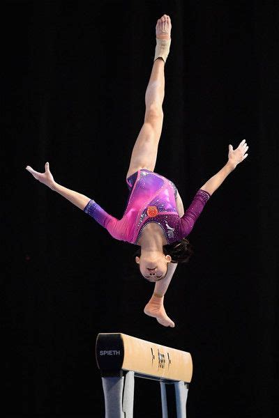 Luo Huan Of China Practises On The Beam During The World Cup Gymnastics