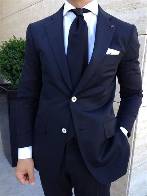 Navy Blue Suit Paired With Solid Navy Tie What Makes This Look Stand