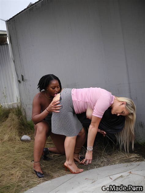 Porn Image Of Saggy Tits Open Mouth Looking At Viewer Full Shot Secretary Garage Created By AI